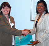 Priscilla Gibson, managing member of Tech-Pro Personnel, congratulates CSCP bursary winner Regina Naicker